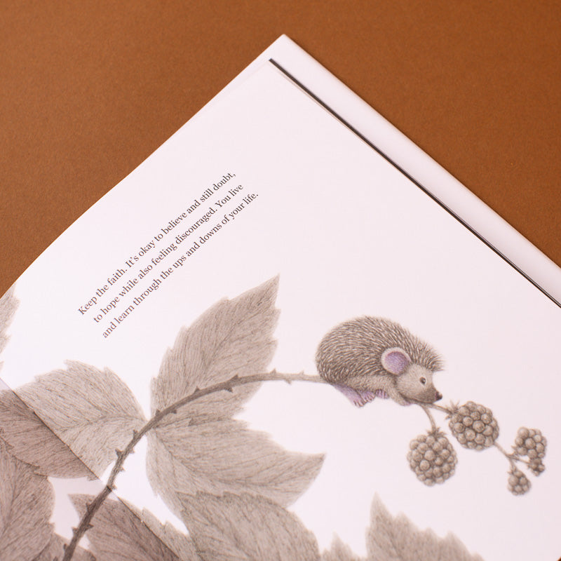 living-brave--how-to-add-more-confidence-to-your-courage open page with hedgehog climbing for berries