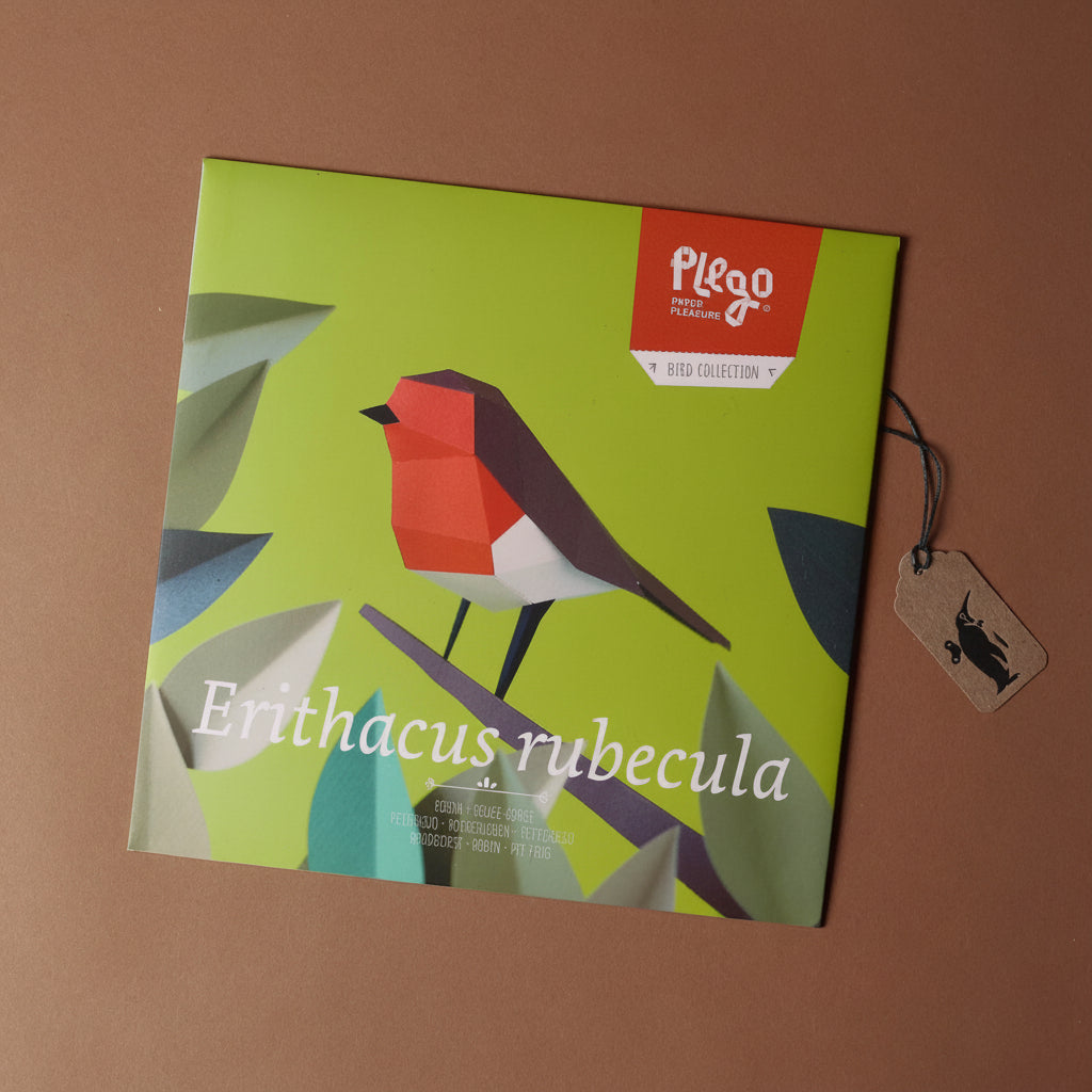 Packaging of Pleco paper craft kit with a robin design on a brown background