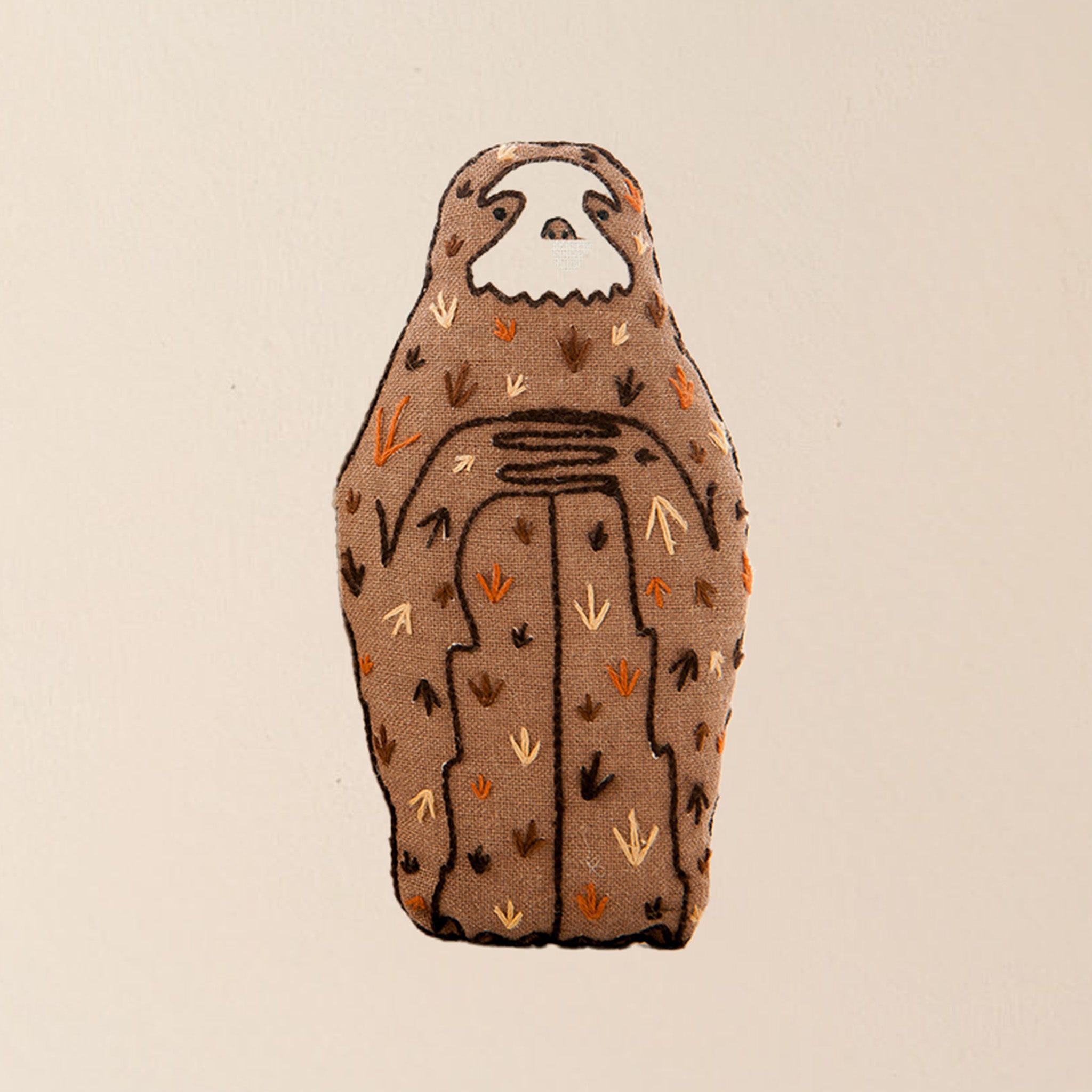 make-your-own-embroidered-animal-kit-sloth-finished-brown-plushie-with-hands-folded-on-knees