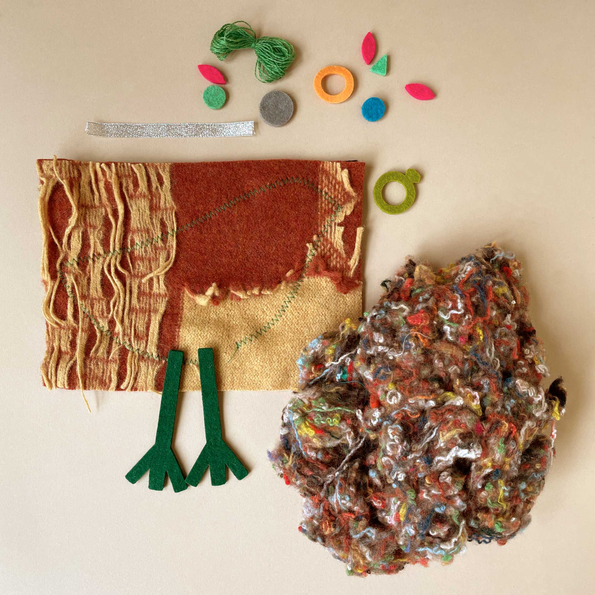Textile materials and tools on a beige background
