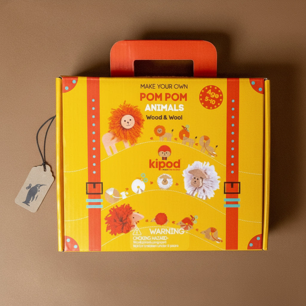 Yellow and red box with pom pom animals branding on a brown background