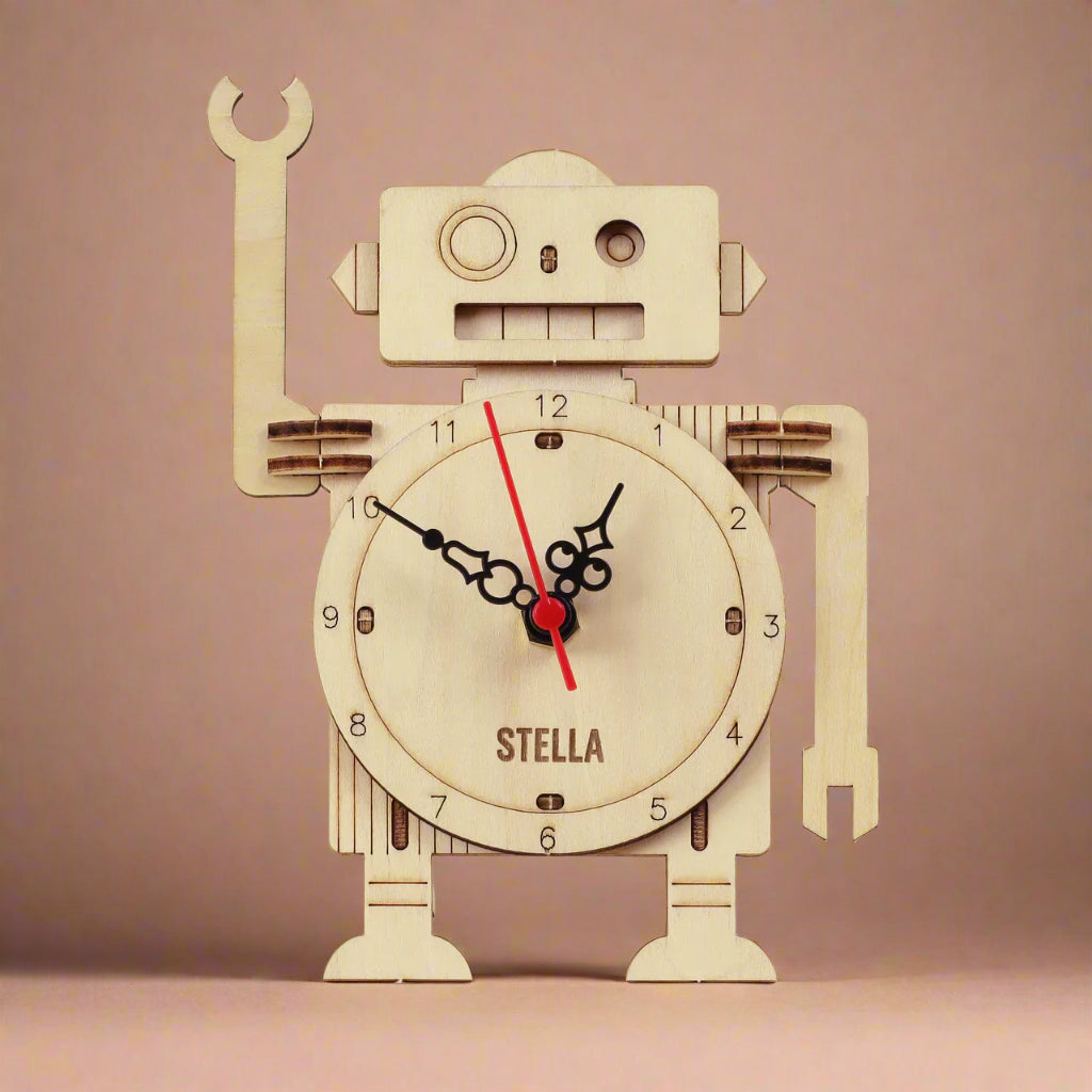 make-your-own-robot-clock-kit Wooden robot clock with 'Stella' branding on a beige background