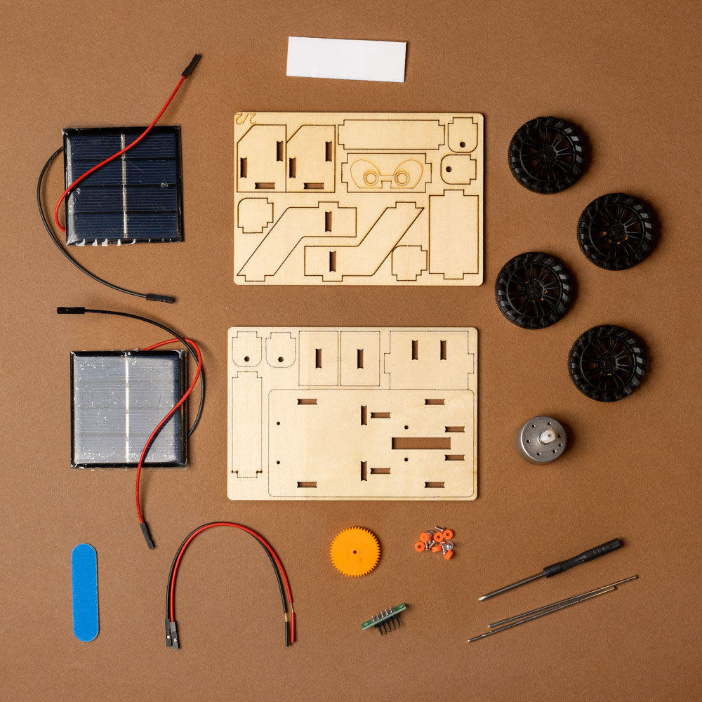 make-your-own-solar-powered-mars-rover-kit Mechanical parts and components on a brown background
