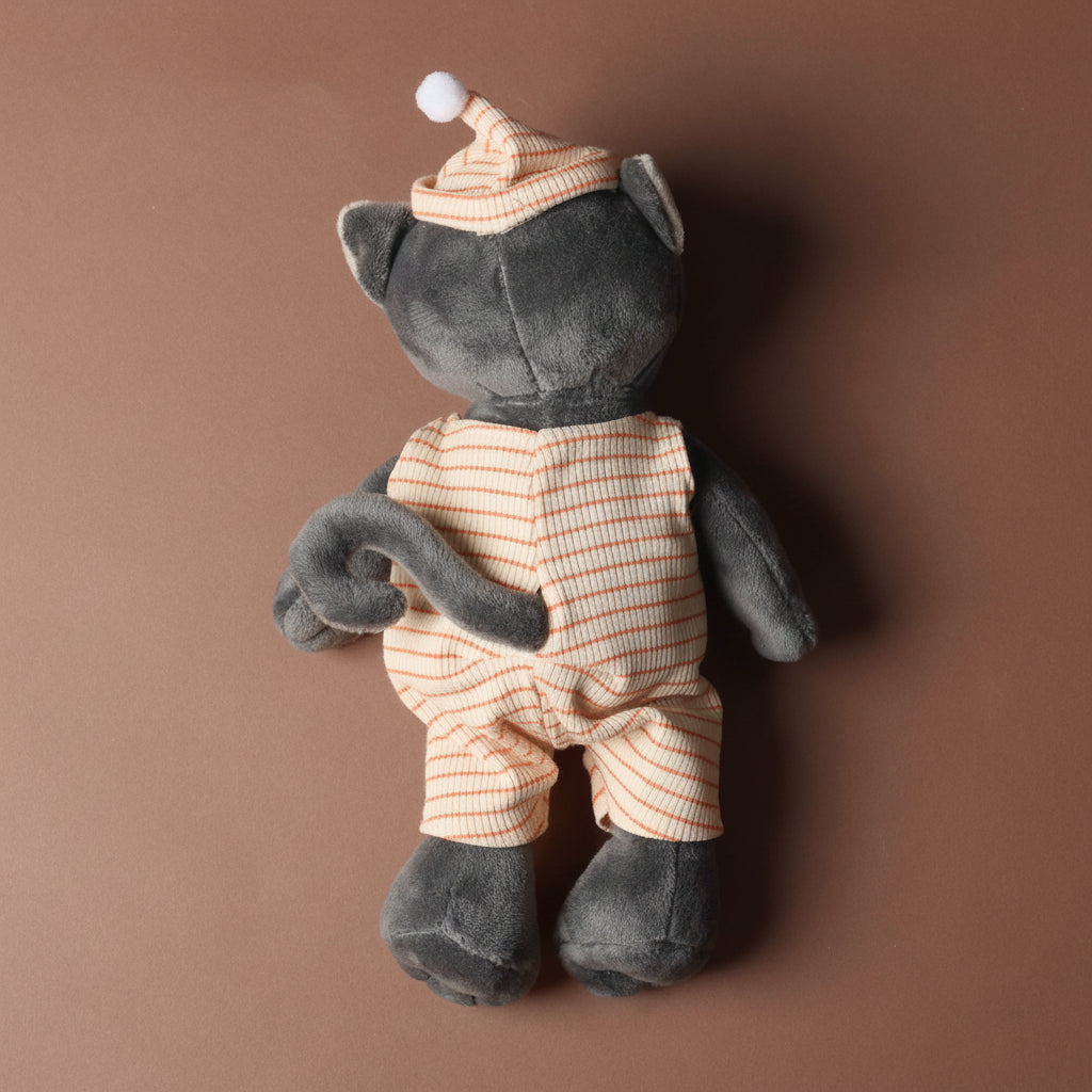 malo-the-cat Stuffed toy cat in a striped outfit and hat on a brown background
