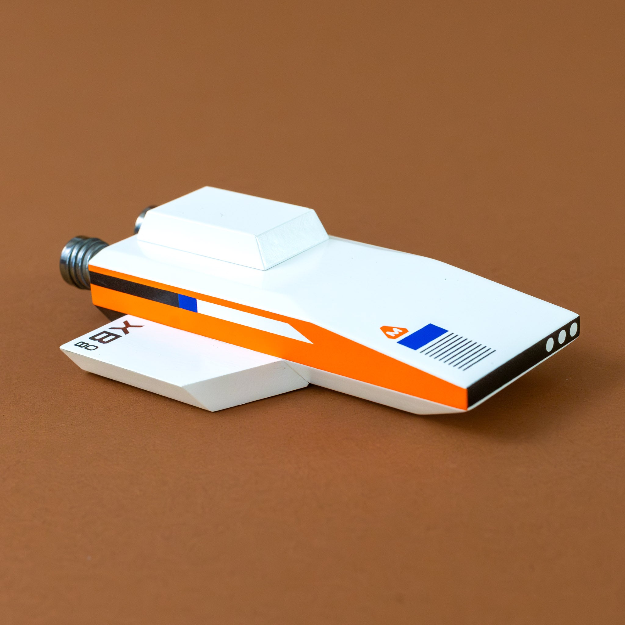 white-and-orange-rocket-ship