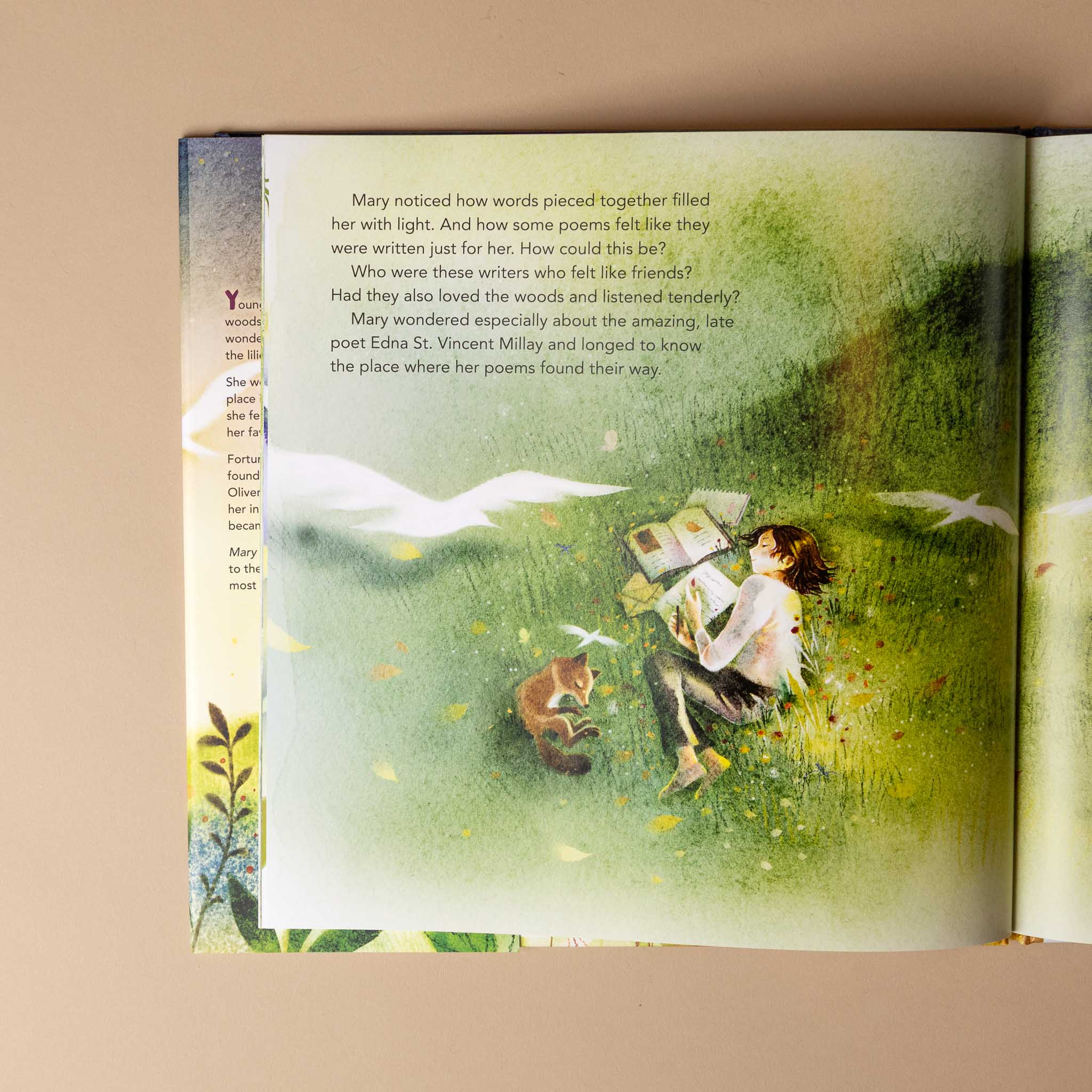 mary-oliver-holding-on-to-wonder Illustrated book open to a page with a girl and fox in a grassy field