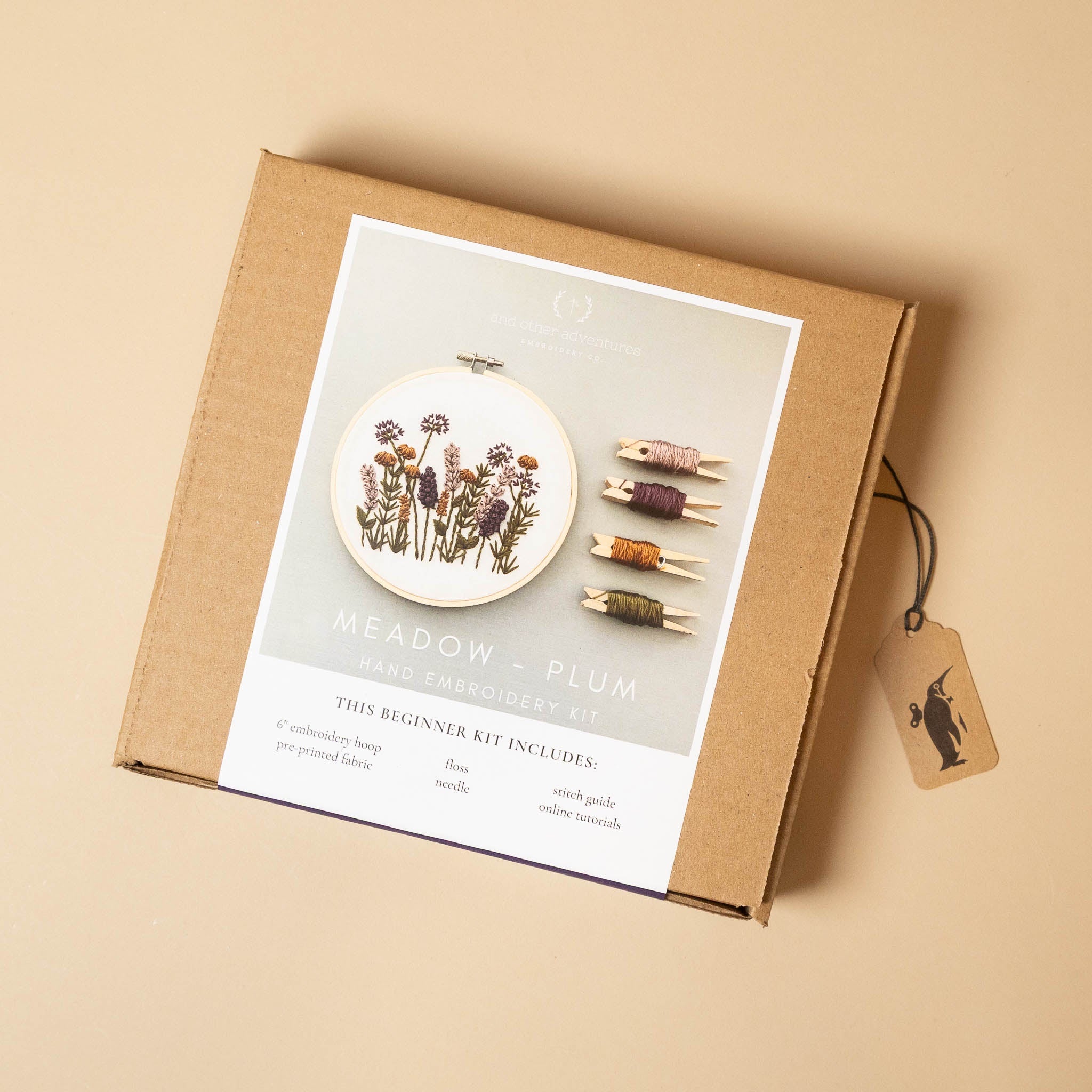 meadow-embroidery-kit-plum packaging with hoop and thread on a beige background