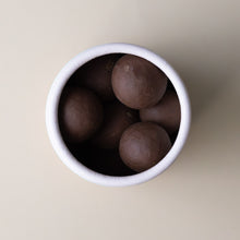 Load image into Gallery viewer, milk-chocolate-covered-caramelized-hazelnuts-in-soft-blue-cylinder