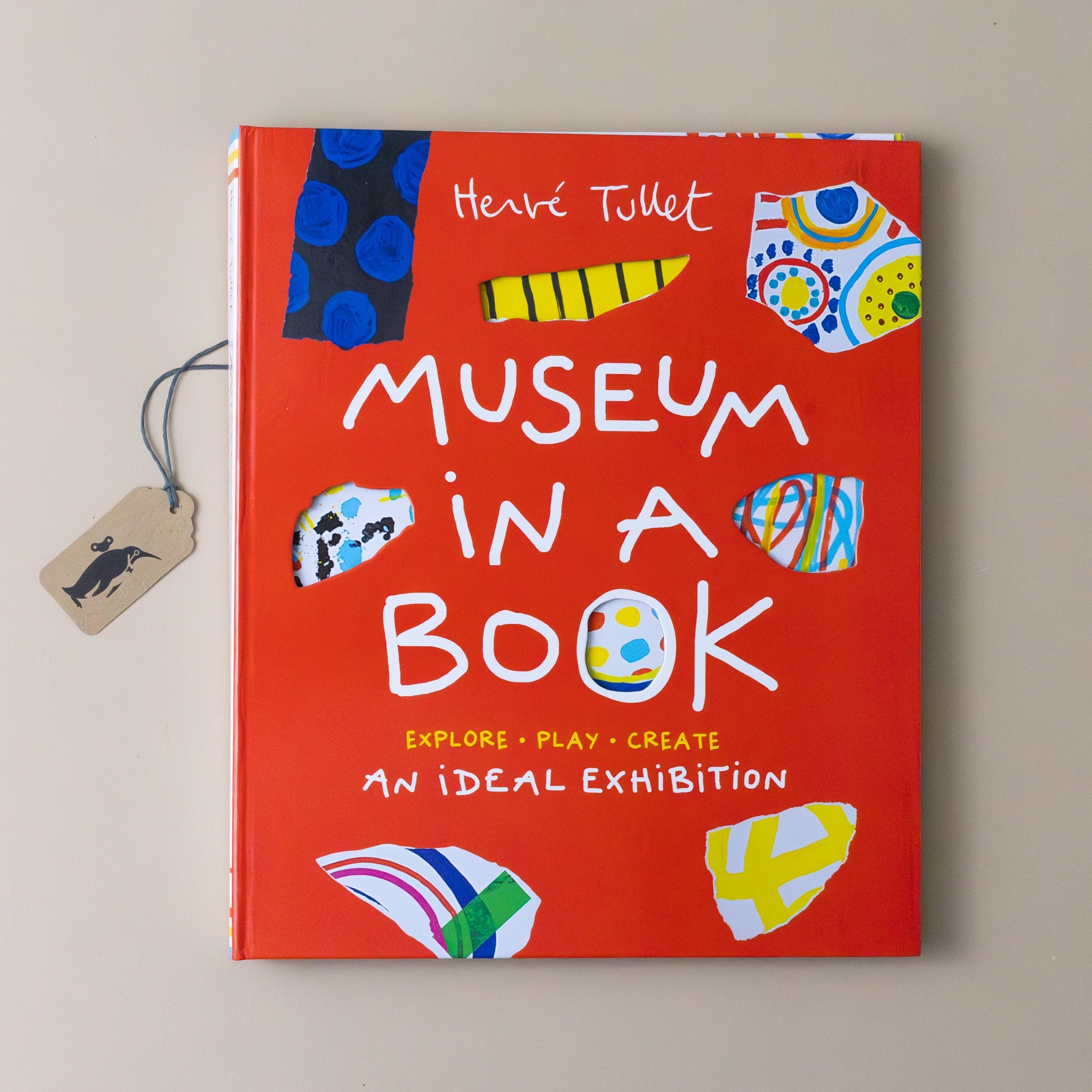 museum-in-a-book-explore-play-create-bright-red-cover-with-examples-of-art-and-patterns