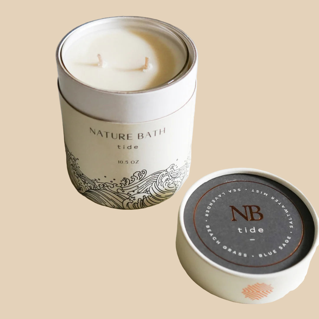 Nature Bath candle in a tin with 'tide' fragrance on a light background