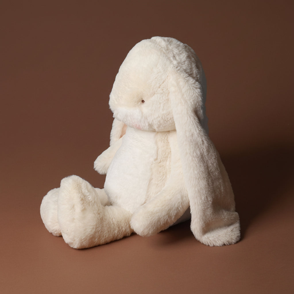 plush nibbles-bunny-cream-large toy on a brown background