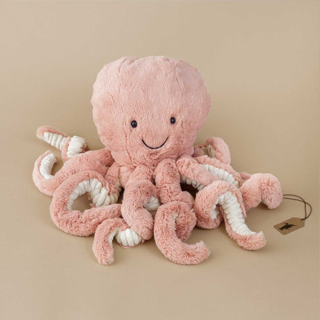odell-octopus_LARGE_blush-colored-stuffed-animal-with-corded-white-under-tenacles