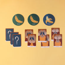 Load image into Gallery viewer, orangutan-game-card-examples-with-oragutan-bananas-and-question-marks