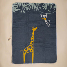 Load image into Gallery viewer, organic-cotton-baby-blanket-yellow-giraffe-with-yellow-shirted-oatmeal-monkey-swinging-from-a-green-leafed-tree-on-charcoal-backdrop