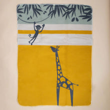 Load image into Gallery viewer, organic-cotton-baby-blanket-charcoal-giraffe-with-charcoal-monkey-swinging-from-a-green-stripe-charcoal-leafed-tree-on-yellow-white-striped-backdrop