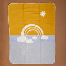 Load image into Gallery viewer, organic-cotton-baby-blanket-cream-rainbow-and-sun-clouds-and-raindrops-on-yellow-blue-grey-sectionedbackdrop