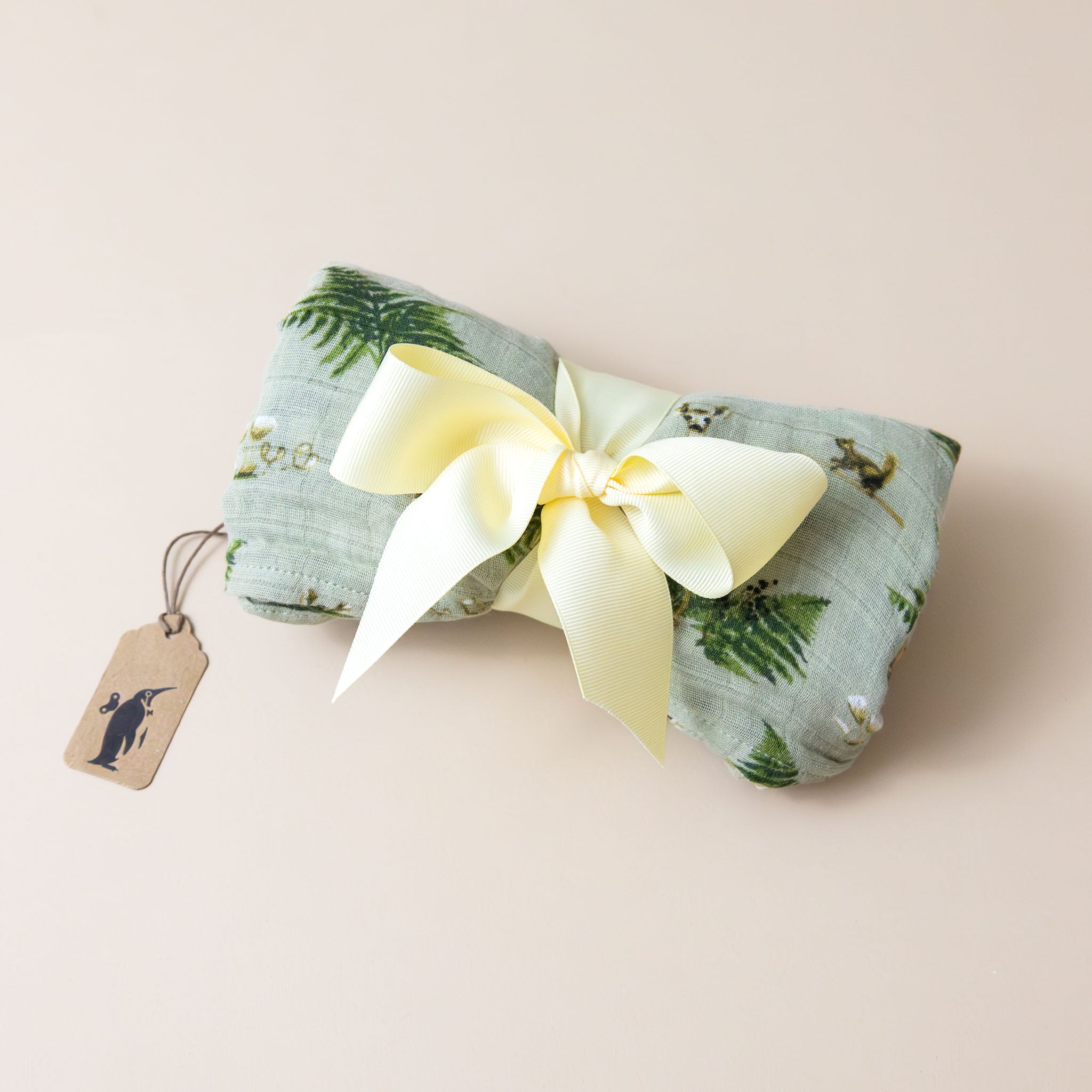 organic-cotton-swaddle-forest-party-tied-in-ribbon