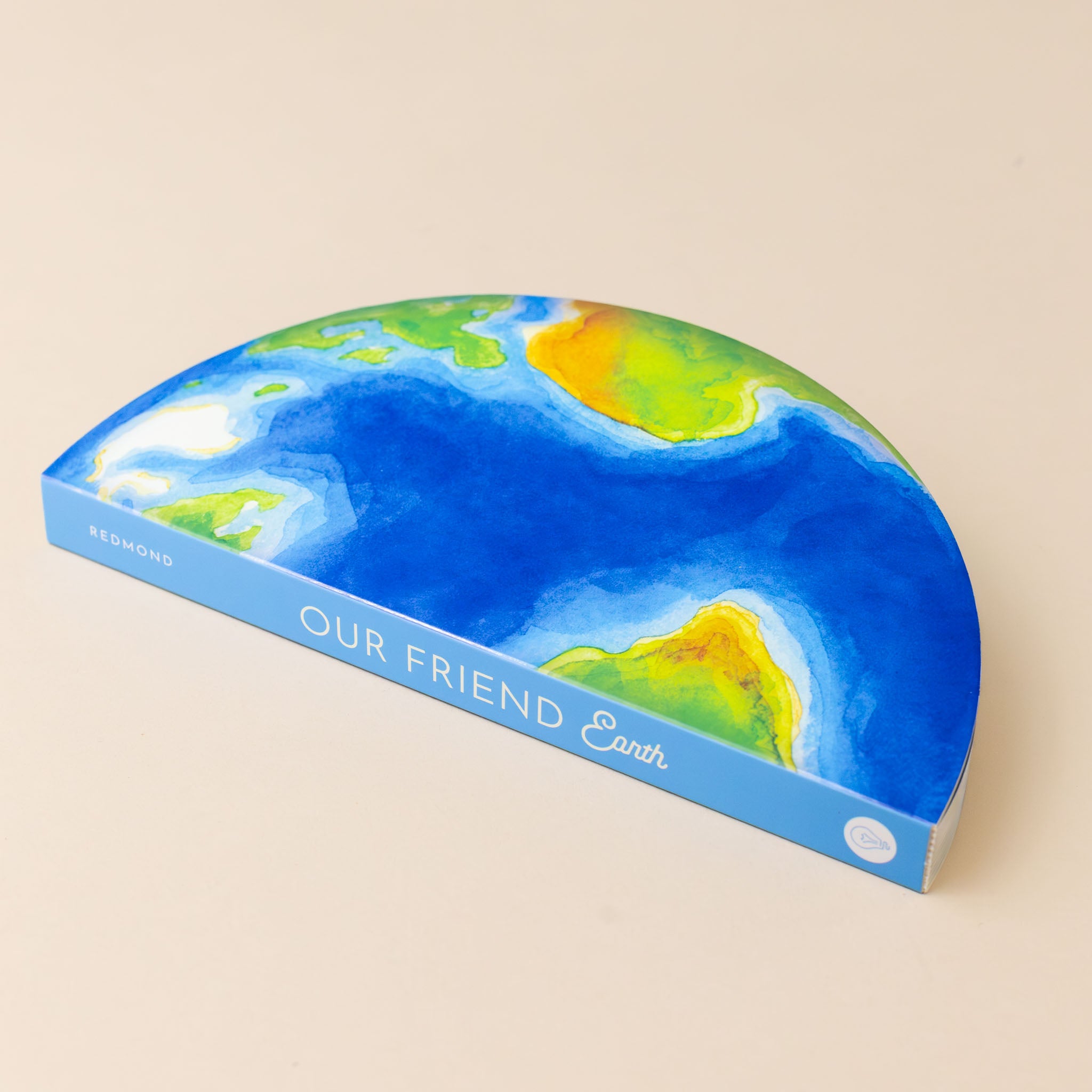 our-friend-earth-board-book-cover-showing-circular-shaped-book-with-bright-blue-ocean-and-green-and-brown-land-masses