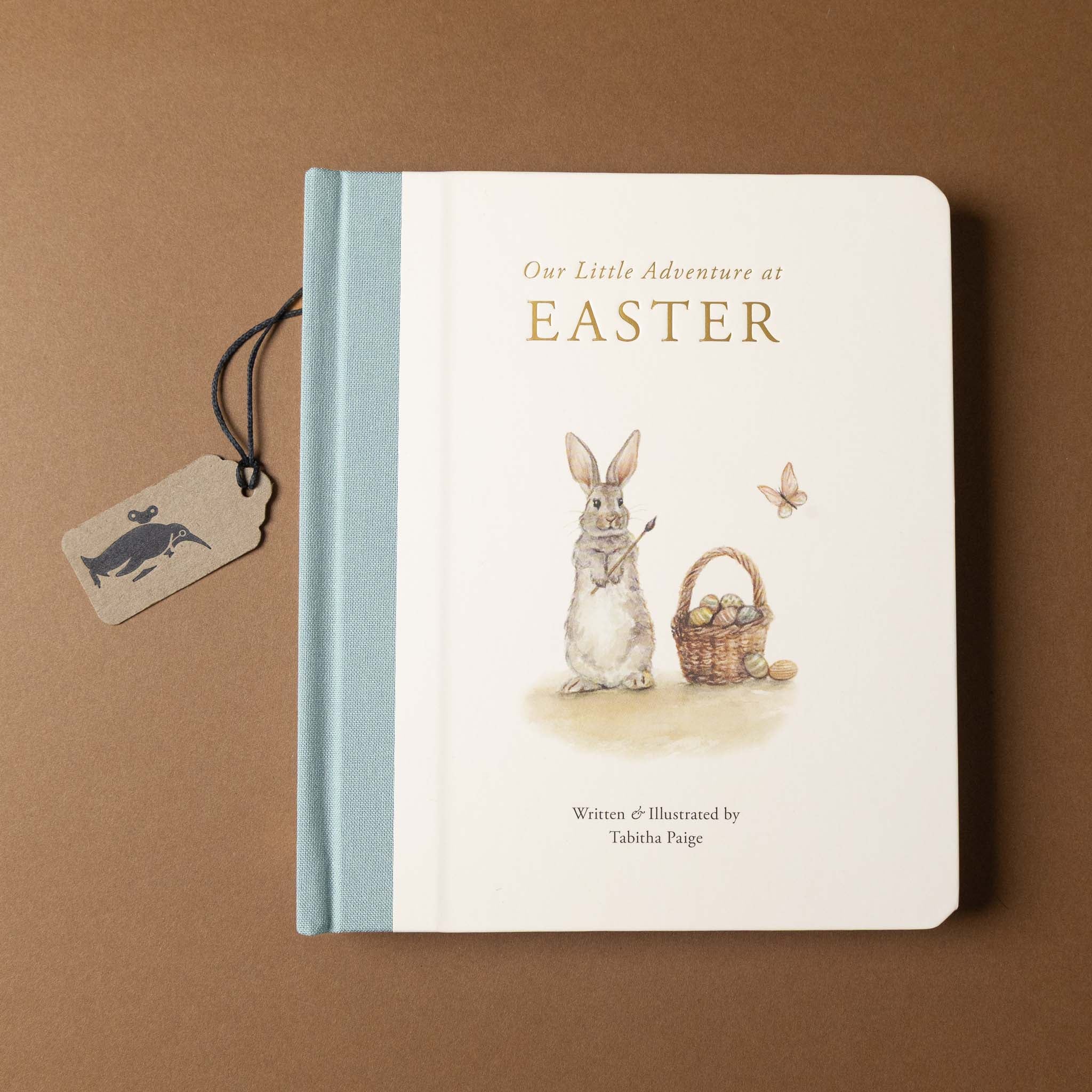 Book titled 'Our Little Adventure at Easter' with a rabbit illustration on a brown background