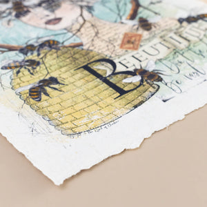 deckle-edge-detail-with-honeycomb-bees-and-text-in-yellow-blue-blush-brown-and-black