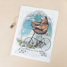 Load image into Gallery viewer, paper-print-blue-skies-with-a-bear-atop-a-tricycle-carefreely-riding-through-blue-skies
