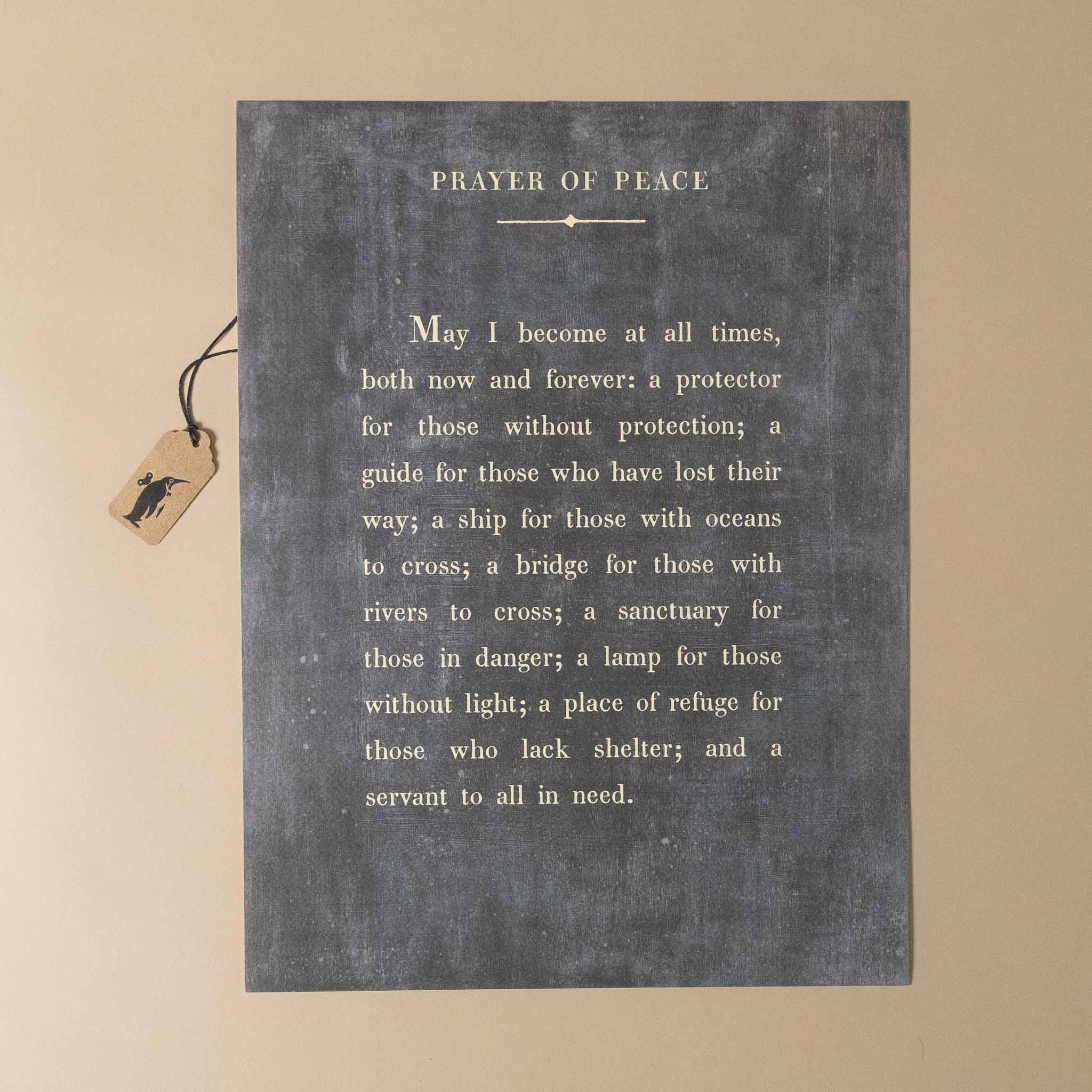 Textual prayer on a chalkboard-style background with a tag attached.