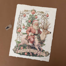 Load image into Gallery viewer, paper-print-winter-wonderland-with-santa-on-a-reindeer-surrounded-by greenery-ornaments-atop-background-of-faint-writing