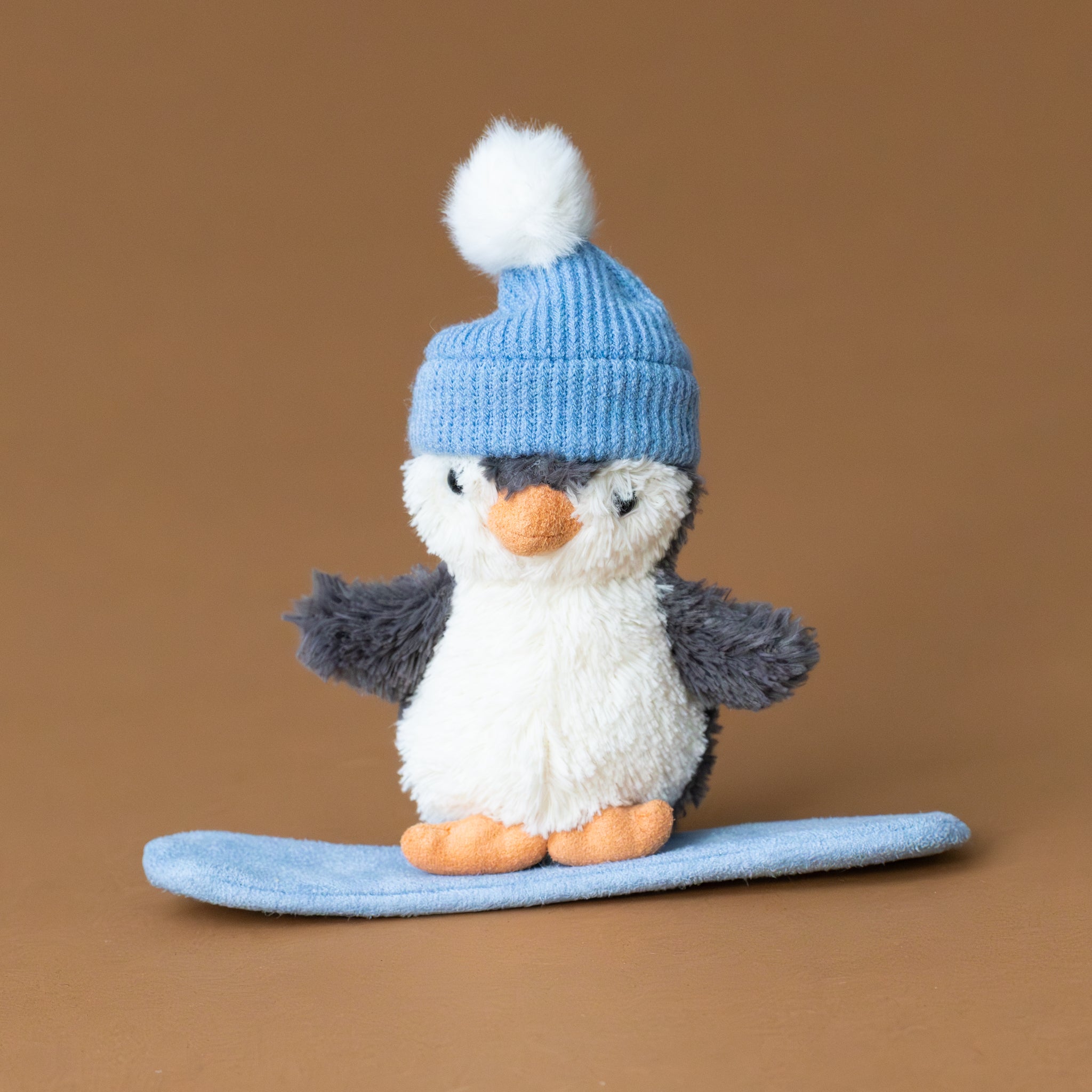 peanut-penguin-snowboarding-small-stuffed-animal-with-light-blue-board-and-hat