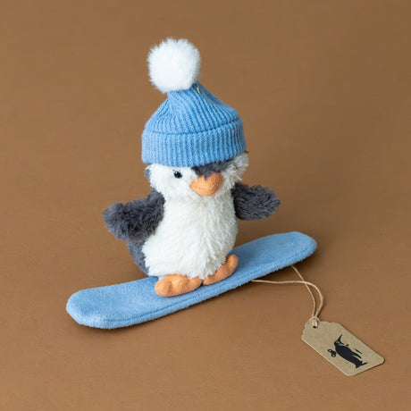 peanut-penguin-snowboarding-small-stuffed-animal-with-light-blue-board-and-hat