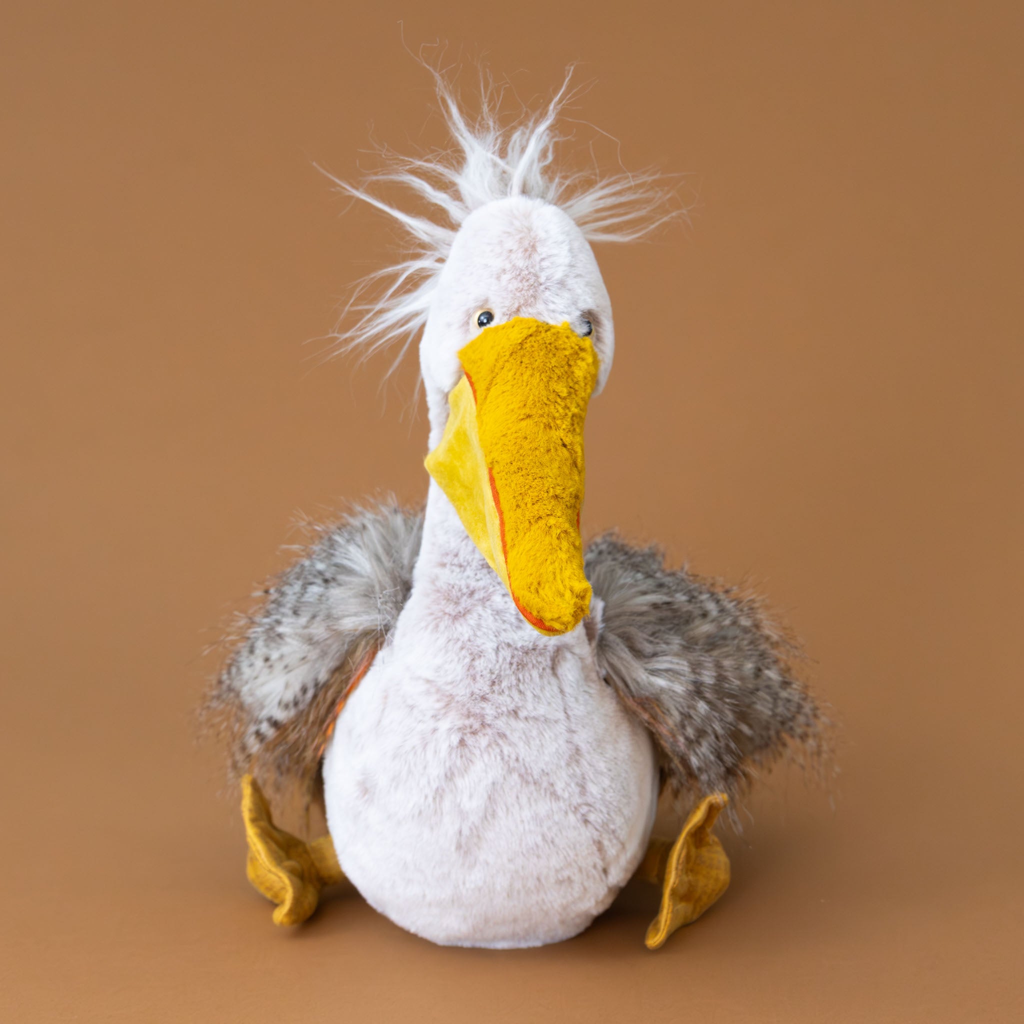 peculiar-pelican-stuffed-animal-with-soft-grey-feathery-fur-and-yellow-beak-and-feet-front