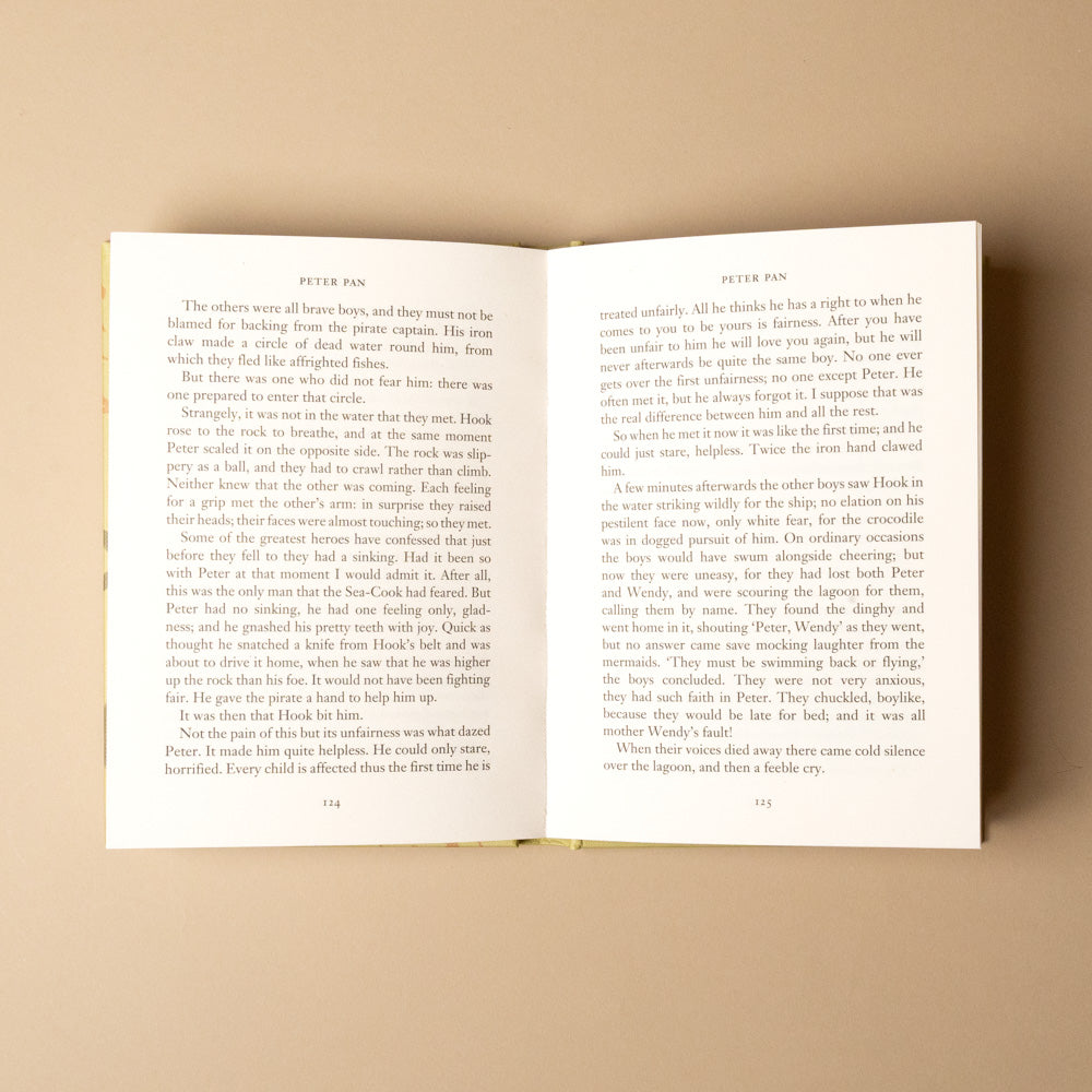 peter-pan Open book with text on a beige background