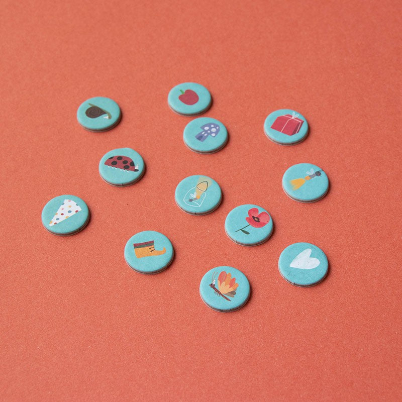 petite-24-piece-observation-puzzle-unicorn Set of small round icons observation pieces with various symbols on a red background