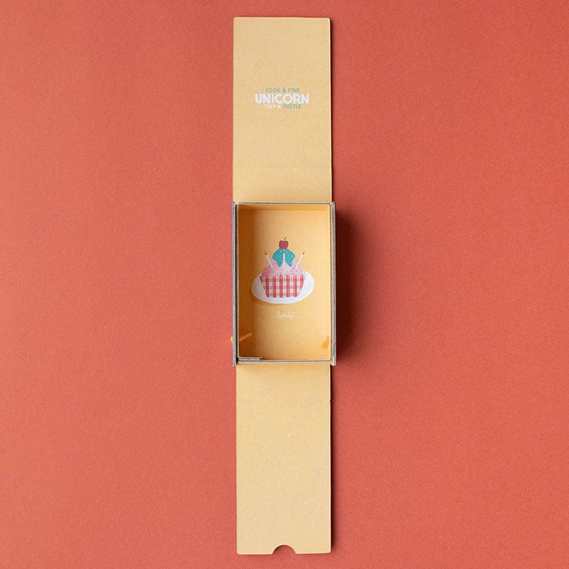 petite-24-piece-observation-puzzle-unicorn box Unicorn-themed product in a cardboard box on a red background