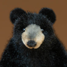 Load image into Gallery viewer, petite-black-bear-stuffed-animal-sitting-with-tan-snout-and-clear-eyes