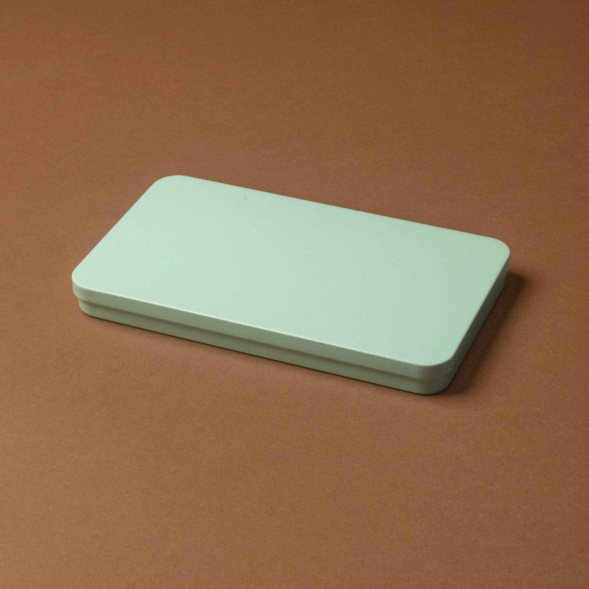 petite-watercolor-painting-kit-wildflower-meadow Rectangular green tin on a brown background