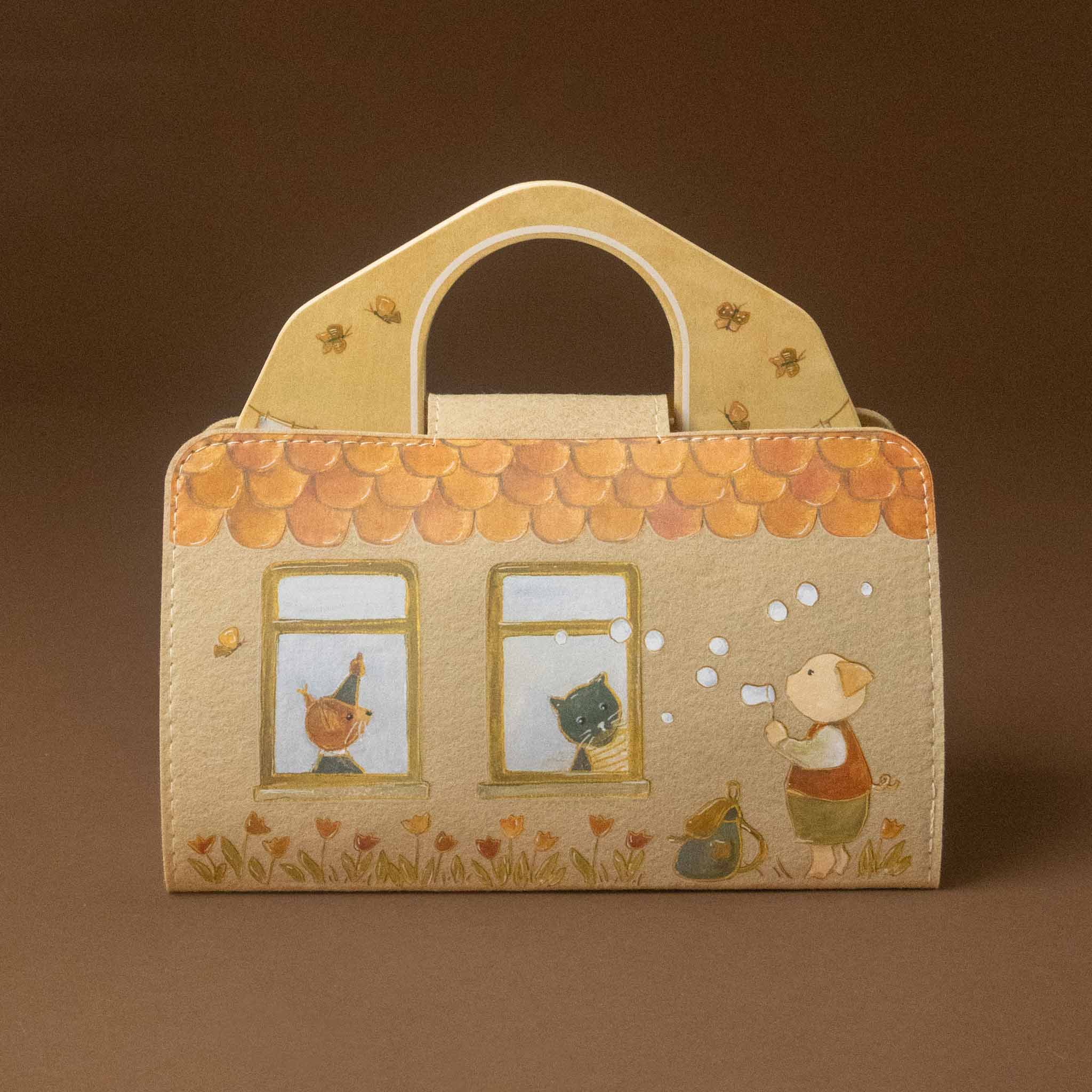 petits-amis-schoolhouse-play-setfeaturing two windows with cartoon animals inside, a pig character outside, and a warm orange scalloped roof on a beige background.
