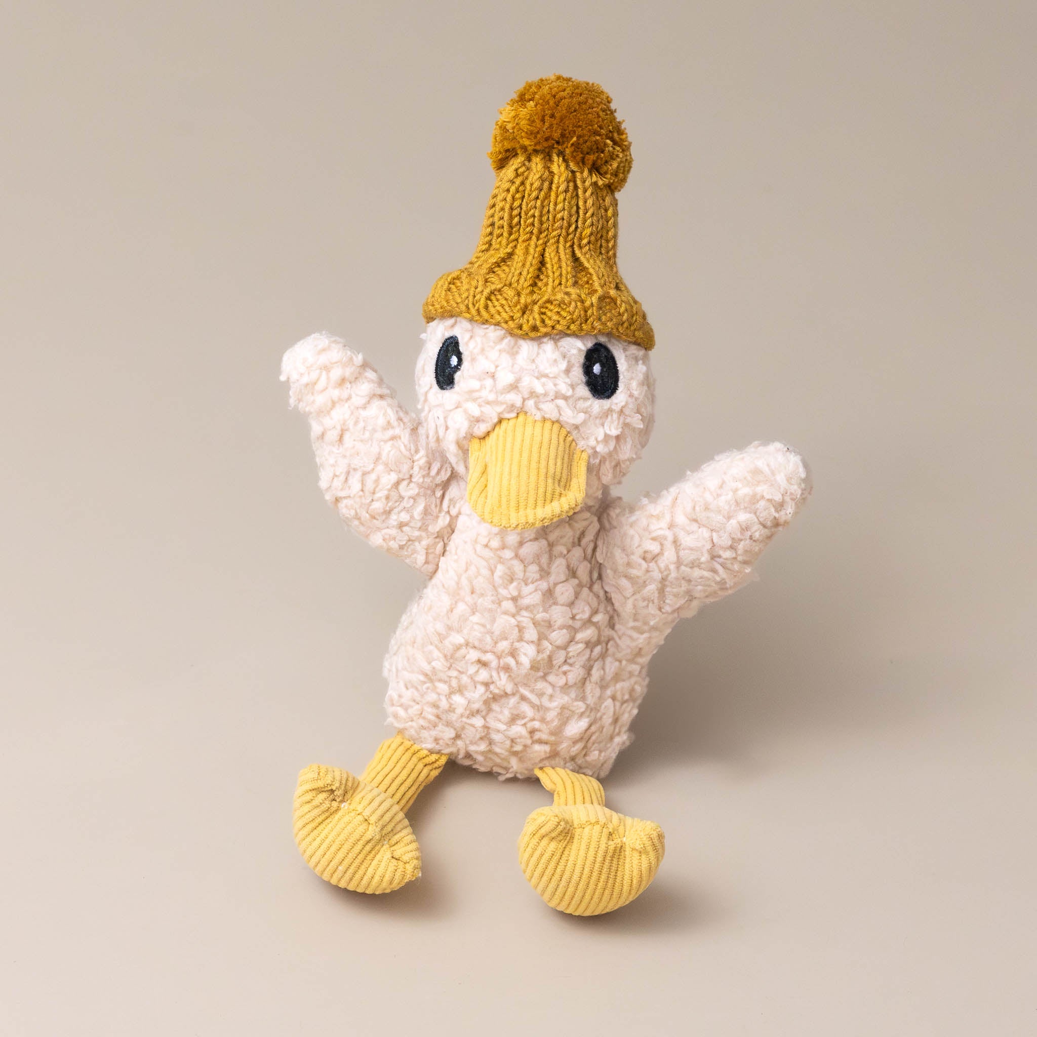 petunia-the-duckling-stuffed-animal-with-caramel-beanie-yellow-corduroy-feet-and-beak-sitting