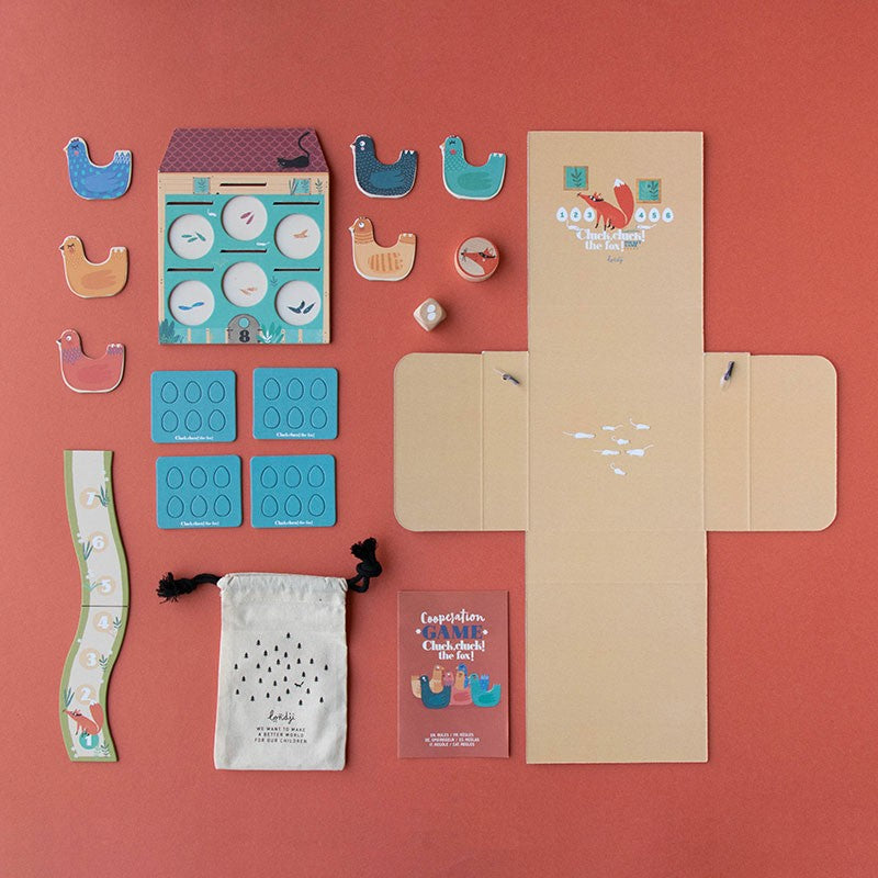 pocket-game-cluck-cluck-the-fox Educational toy set with colorful pieces on a red background