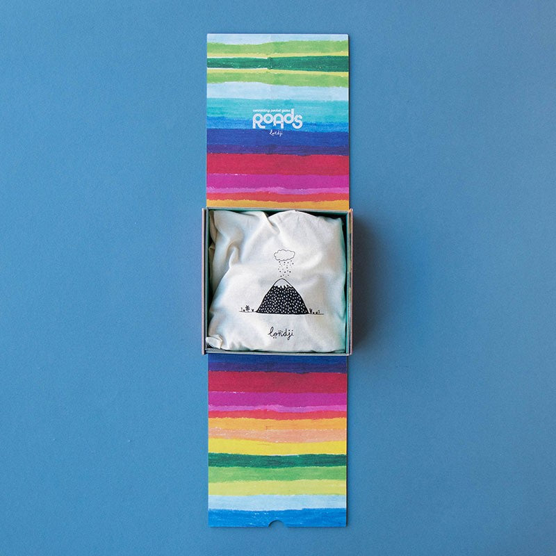 pocket-game-roads Colorful striped box with a white drawsting bag inside on a blue background