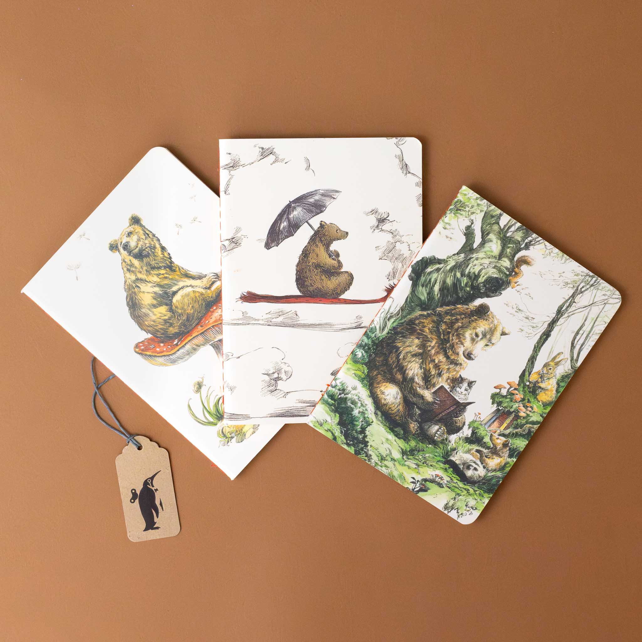 three-book-covers-with-bear-on-red-carpet-flying-through-sky-bear-reading-book-leaning-on-tree-in-forest-with-cub-kitten-and-rabbit-listening-and-bear-resting-atop-a-toadstool