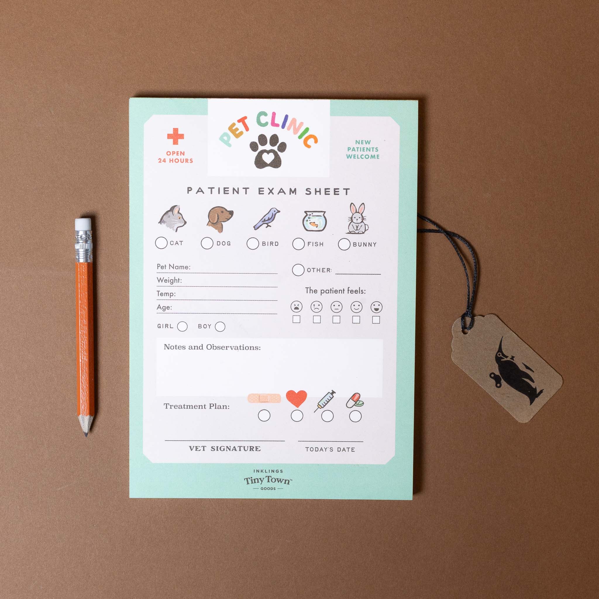 Pet clinic patient exam sheet with a pencil and tag on a brown background