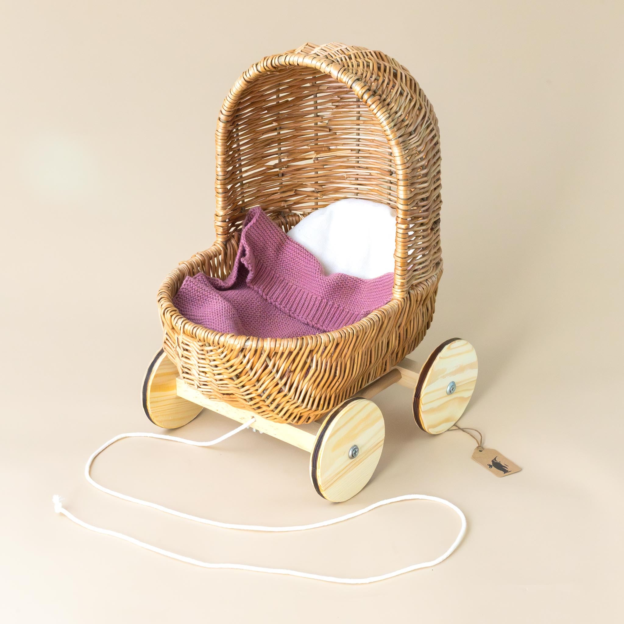 pull-along-wicker-pram-with-pink-blanket-and-pad-with-rope-pull