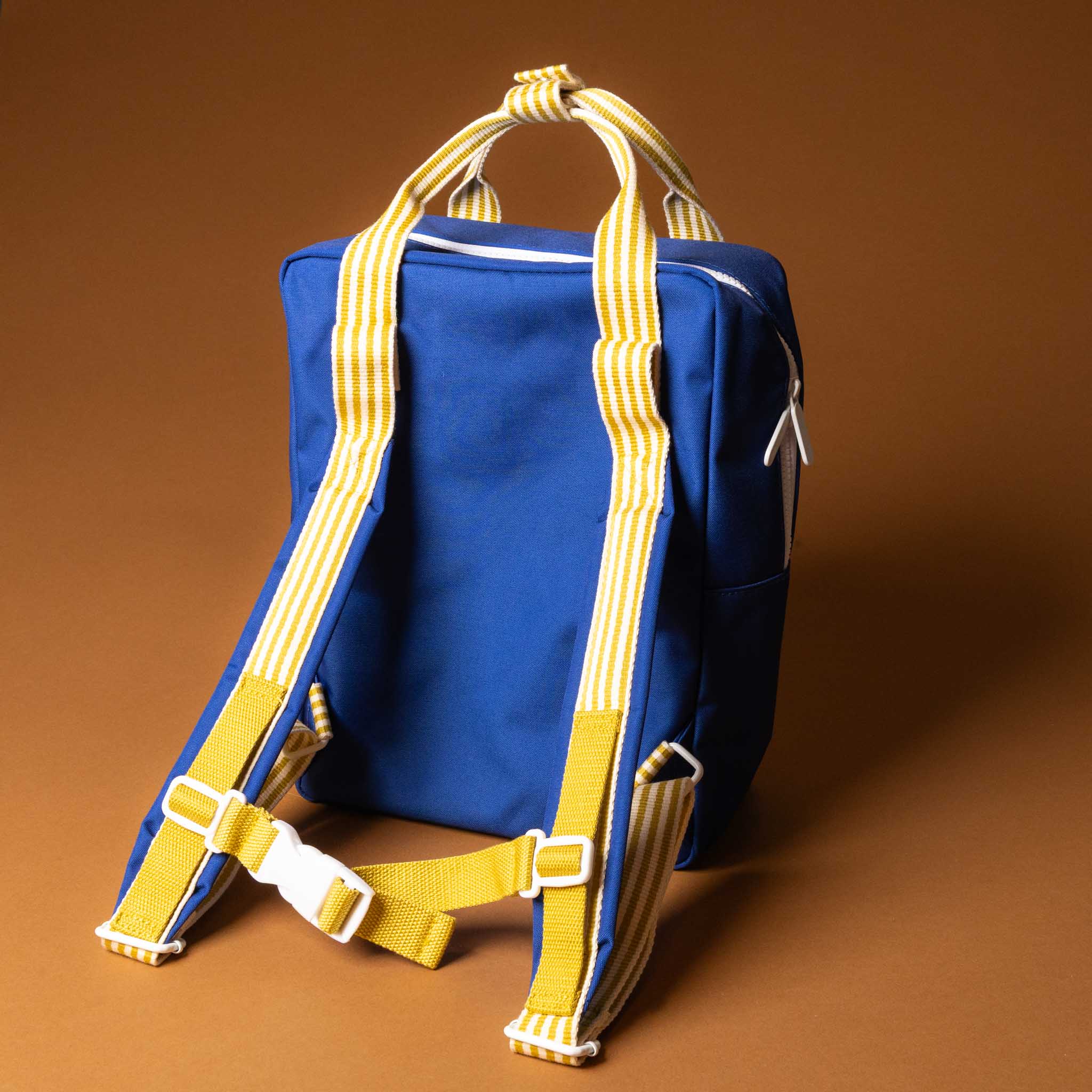 recycled-wonders-envelope-backpack-medium-deep-sea-blue-with-orange-pocket-yellow-striped-straps