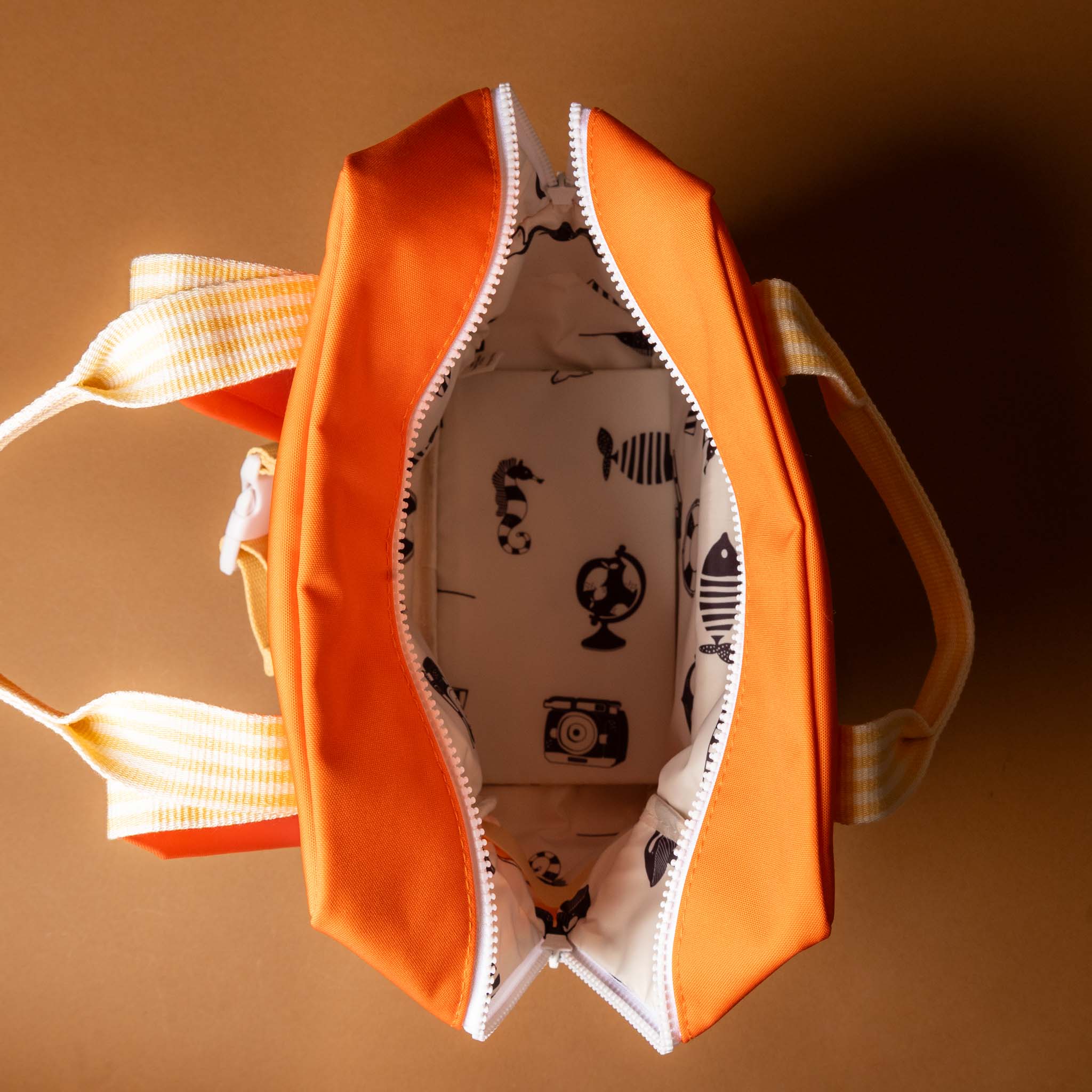 recycled-wonders-envelope-backpack-medium-lifebuoy-orange-with-a-blue-pocket-orange-striped-straps-open