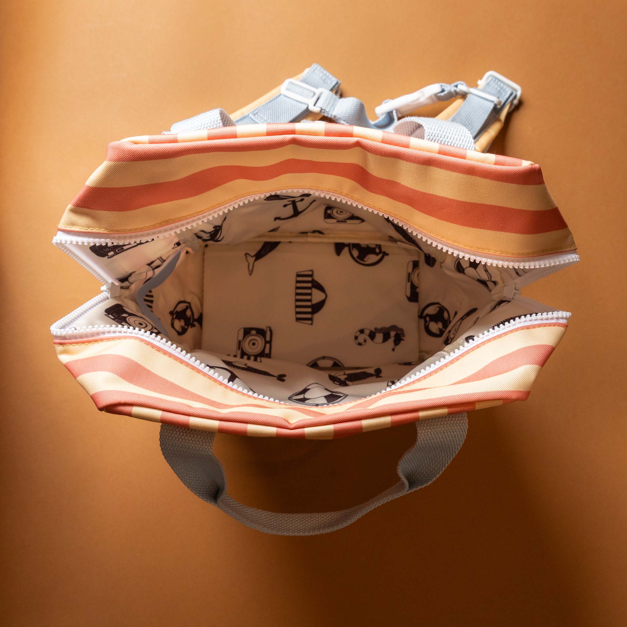 open-recycled-wonders-envelope-backpack-medium-melon-stripe-orange-front-pocket-blue-straps
