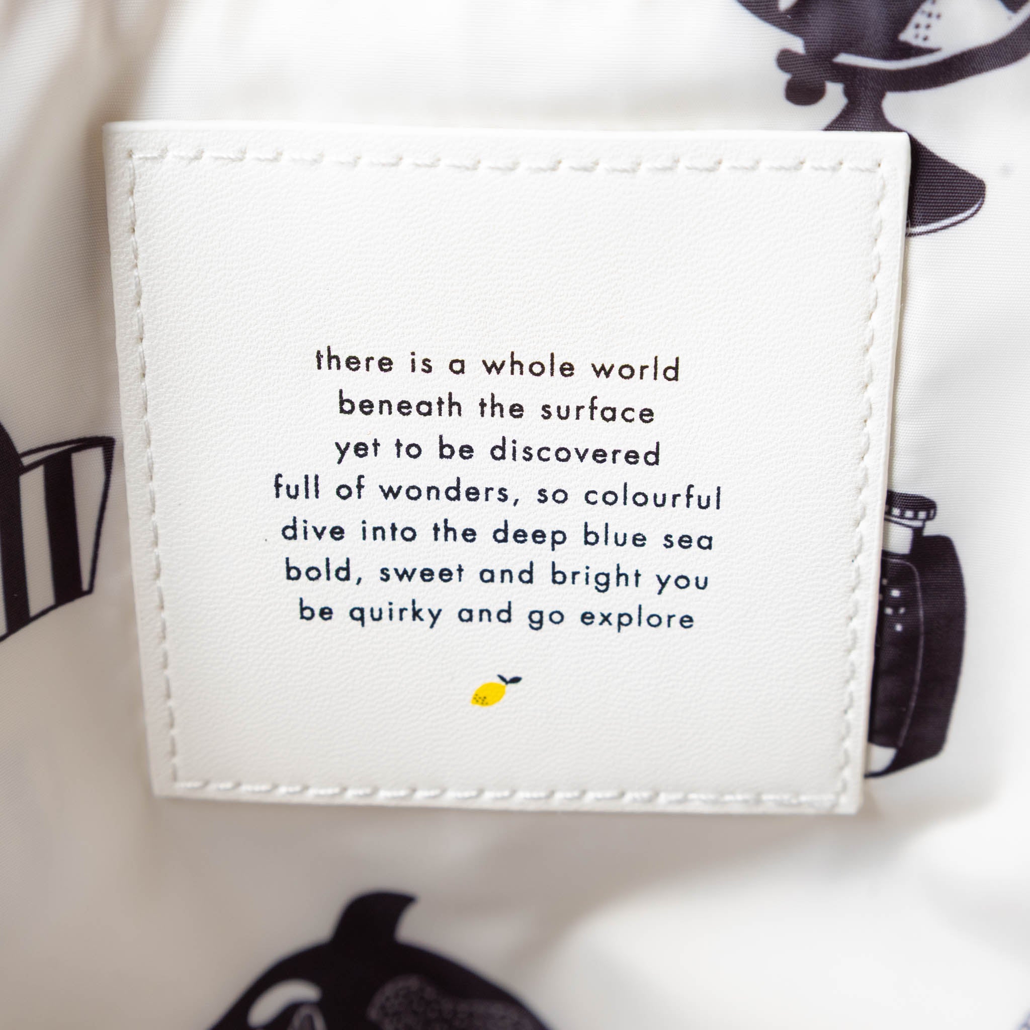 recycled-wonders-envelope-backpack-medium-ocean-stripe-with-a-yellow-pocket-with-sandy-straps-interior-quote