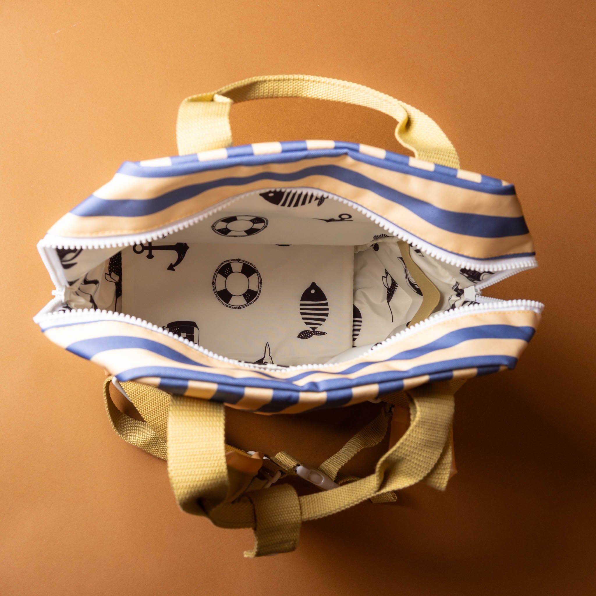 recycled-wonders-envelope-backpack-medium-ocean-stripe-with-a-yellow-pocket-with-sandy-straps-open