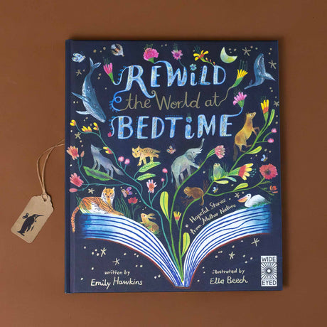  rewild-the-world-at-bedtime-navy-cover-with-colorful-flowers-and-animals-adorning