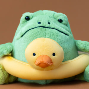 ricky-green-rain-frog-with-yellow-rubber-duckie-ring-stuffed-animal-with-a-pouting-face