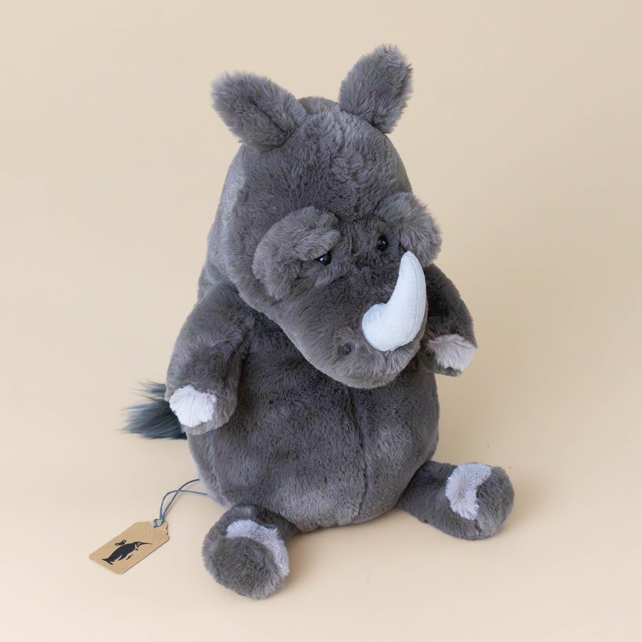 roderick-rhinoceros-grey-stuffed-animial-with-light-grey-horn-hooves-and-fluffy-tail